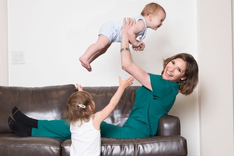 Mom on couch with two kids