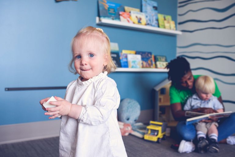 toddler in white dress