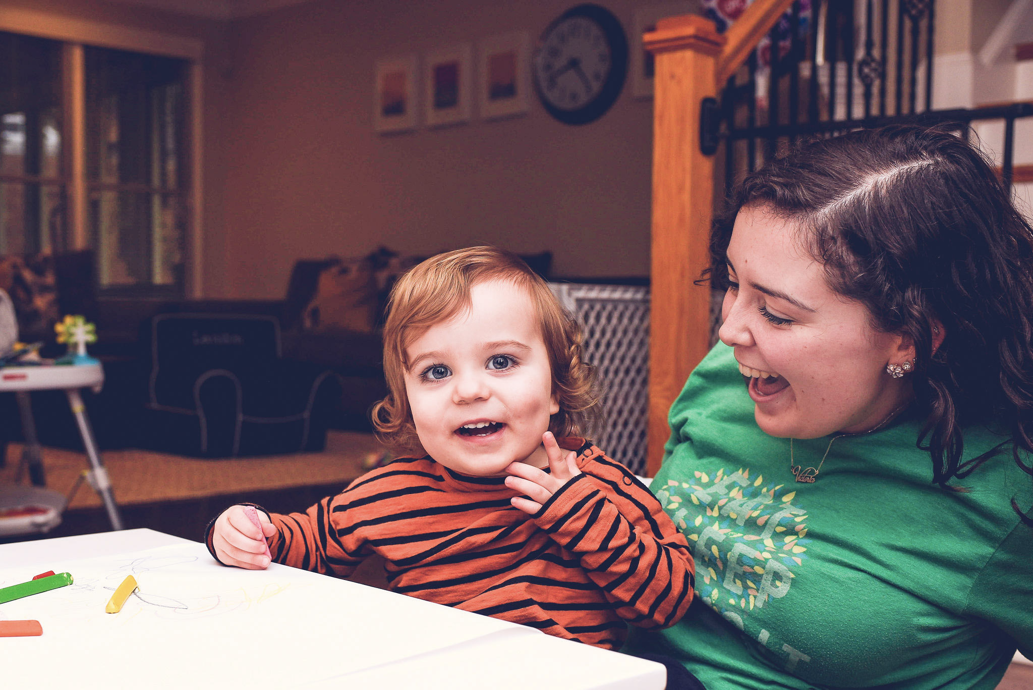 babysitter does a fall craft with a toddler