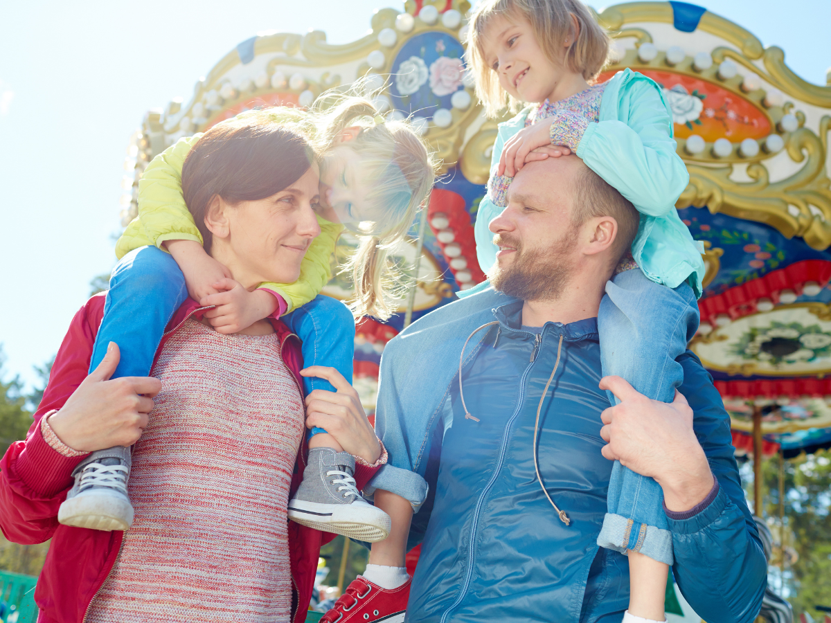 Things to Do in Dallas with Kids: family at an amusement park