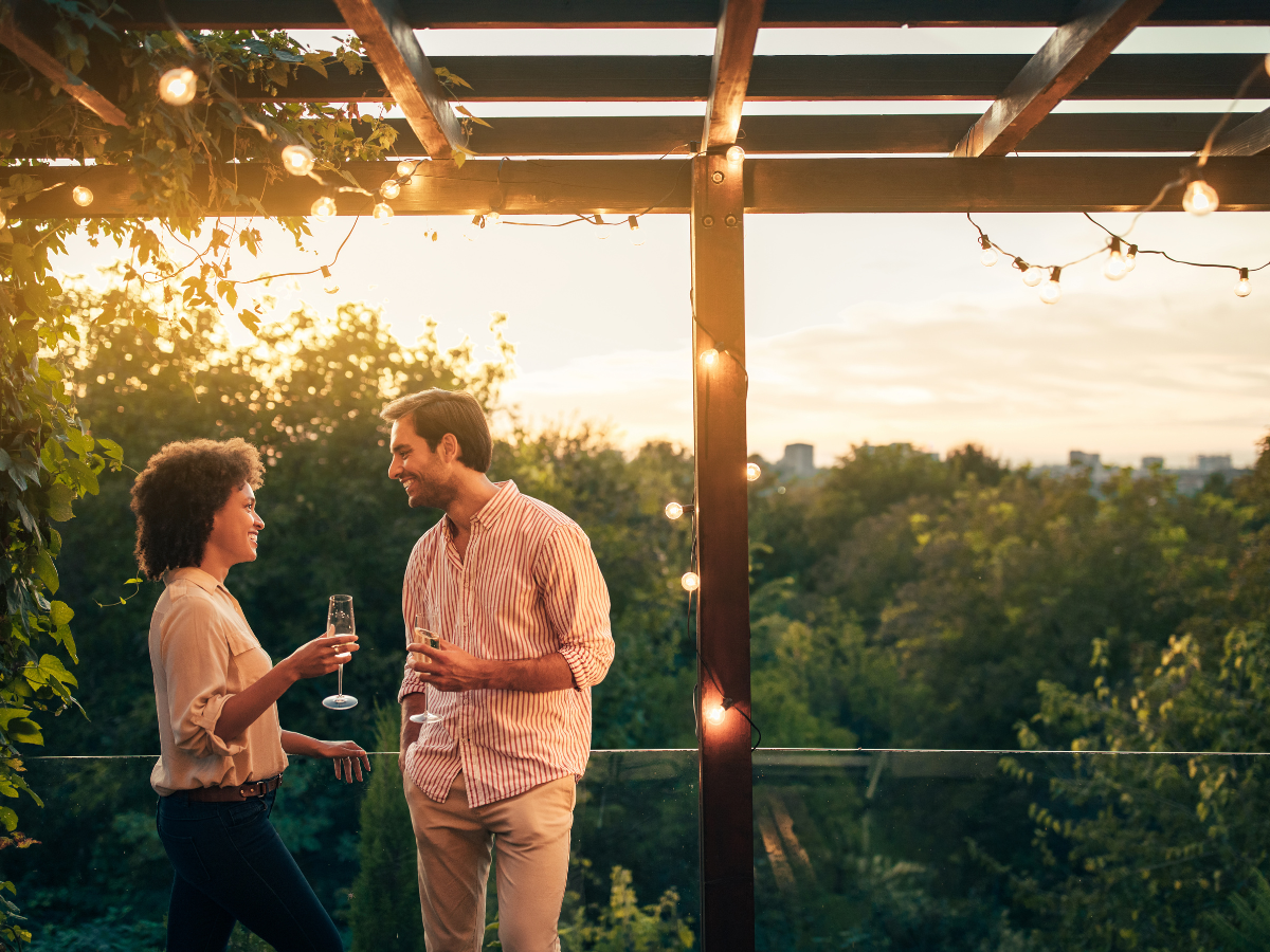 couple drinking wine on a balcony