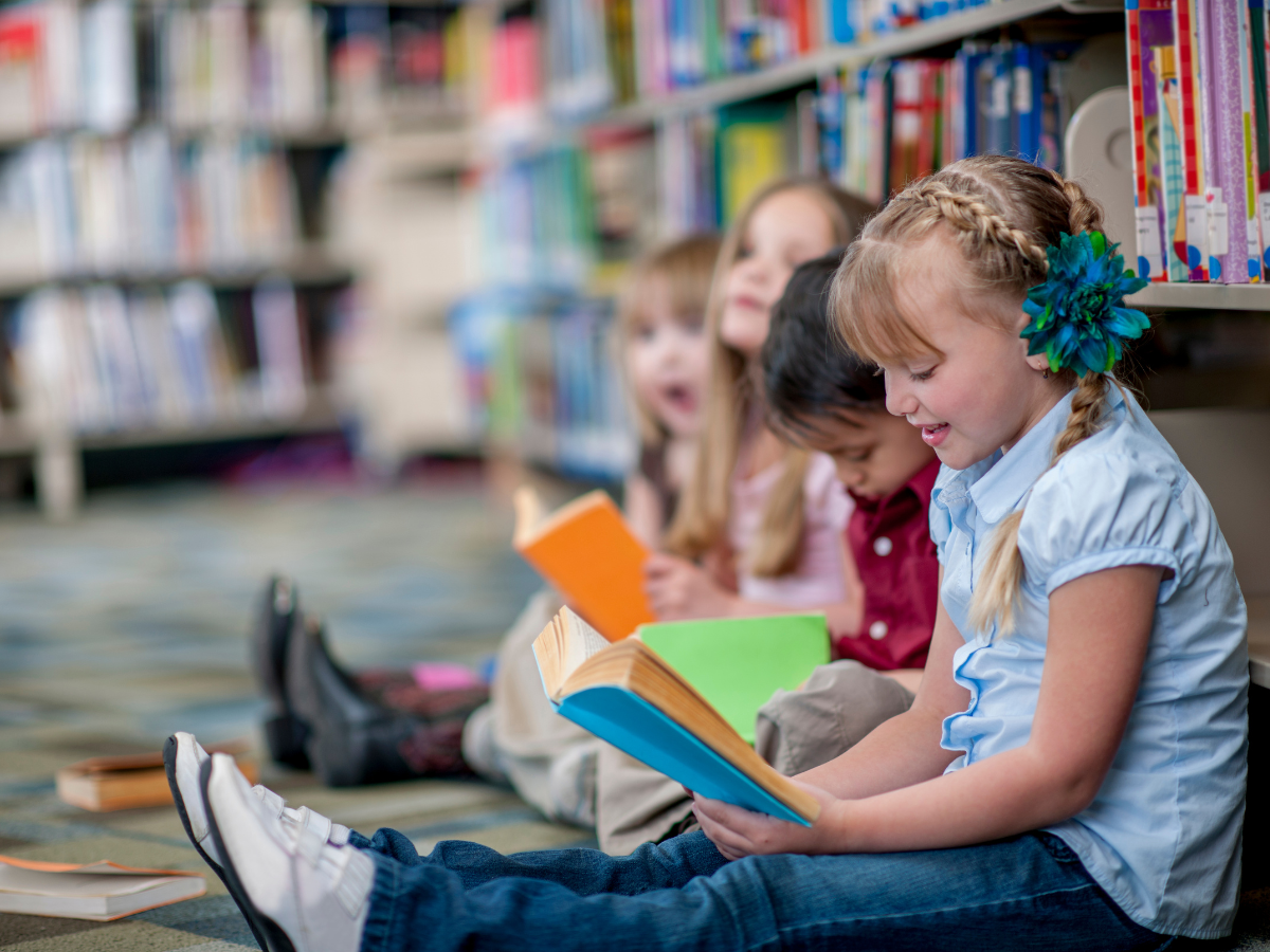 kids reading at a library