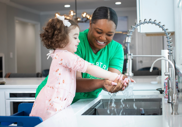 Flexible jobs for college students: babysitter helping little girl wash her hands